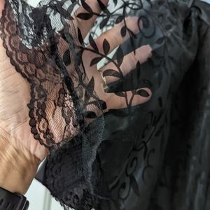 Ladies, high low black skirt with a silk underlining layered in black lace.